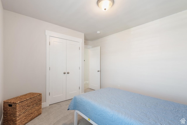 10773 S Beach Comber Way S, Jordan, UT 84009 - bedroom featuring light carpet, a closet, and baseboards