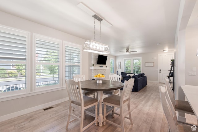 10773 S Beach Comber Way S, Jordan, UT 84009 - dining room featuring baseboards, light wood finished floors, and ceiling fan
