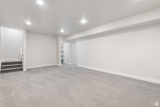 10773 S Beach Comber Way S, Jordan, UT 84009 - finished below grade area with recessed lighting, carpet flooring, baseboards, and stairs