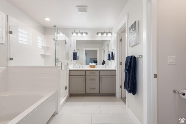 10773 S Beach Comber Way S, Jordan, UT 84009 - full bath featuring double vanity, a stall shower, tile patterned floors, a garden tub, and baseboards