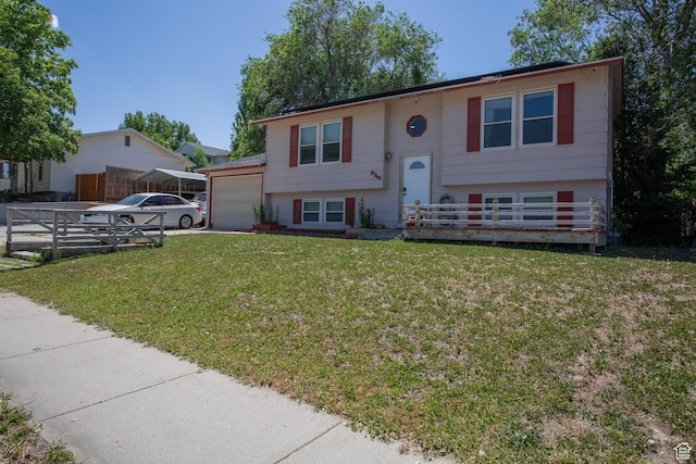 3746 S 7200 W, Magna, UT 84044 - raised ranch with a front lawn, a garage, and concrete driveway