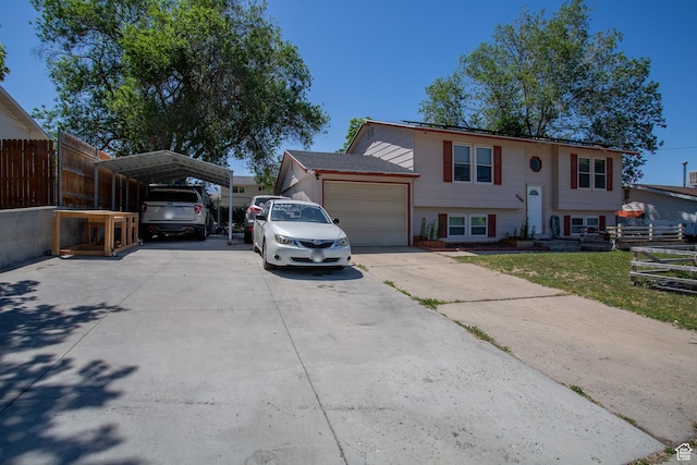 3746 S 7200 W, Magna, UT 84044 - split foyer home featuring a detached carport, driveway, and an attached garage