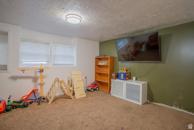 3746 S 7200 W, Magna, UT 84044 - game room with carpet, a textured ceiling, and baseboards