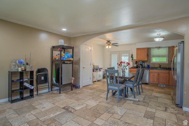 3746 S 7200 W, Magna, UT 84044 - dining space with arched walkways, stone tile flooring, a ceiling fan, recessed lighting, and baseboards