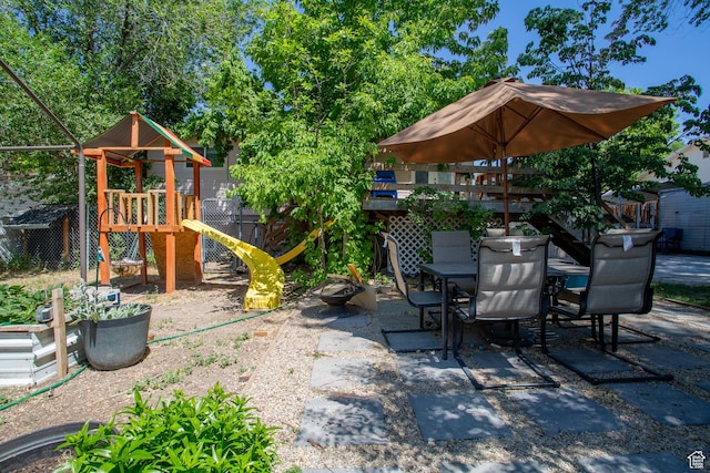 3746 S 7200 W, Magna, UT 84044 - view of patio / terrace with a playground and outdoor dining area