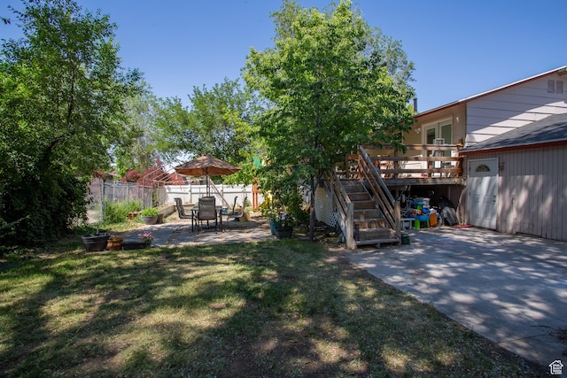 3746 S 7200 W, Magna, UT 84044 - view of yard featuring a patio, a deck, and stairway