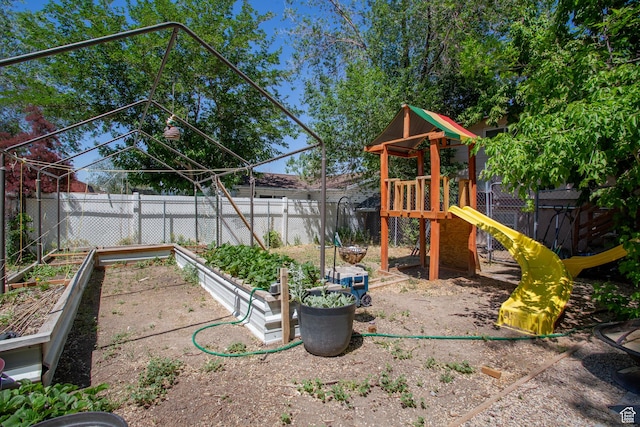3746 S 7200 W, Magna, UT 84044 - view of jungle gym featuring a vegetable garden