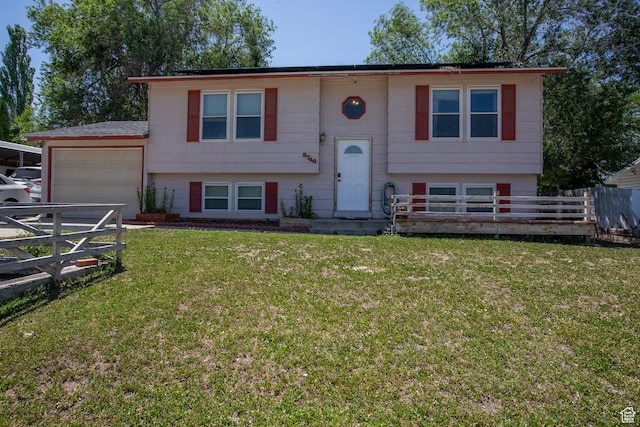3746 S 7200 W, Magna, UT 84044 - raised ranch with a garage and a front lawn