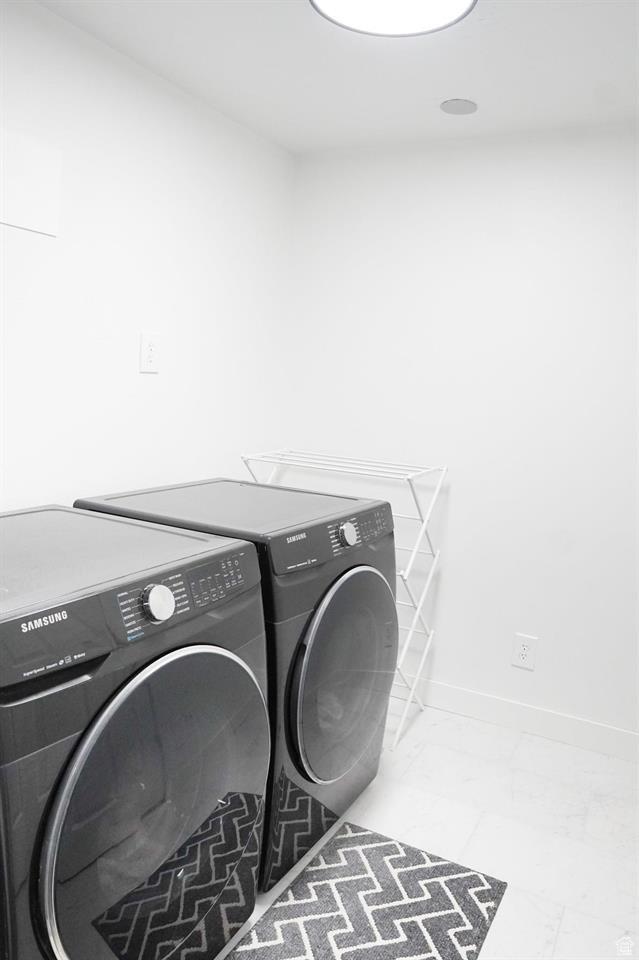 1204 Hyperion Way, Soda Springs, ID 83276 - washroom featuring independent washer and dryer, marble finish flooring, and baseboards