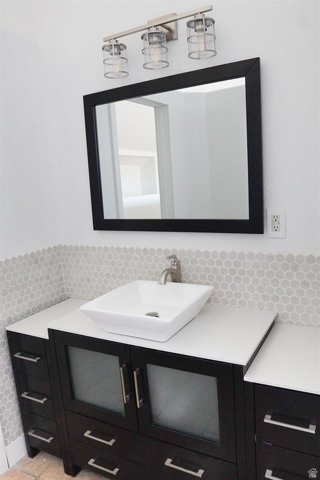 1204 Hyperion Way, Soda Springs, ID 83276 - bathroom featuring vanity and decorative backsplash