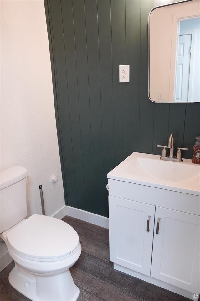 1204 Hyperion Way, Soda Springs, ID 83276 - bathroom with vanity, toilet, wood finished floors, and baseboards