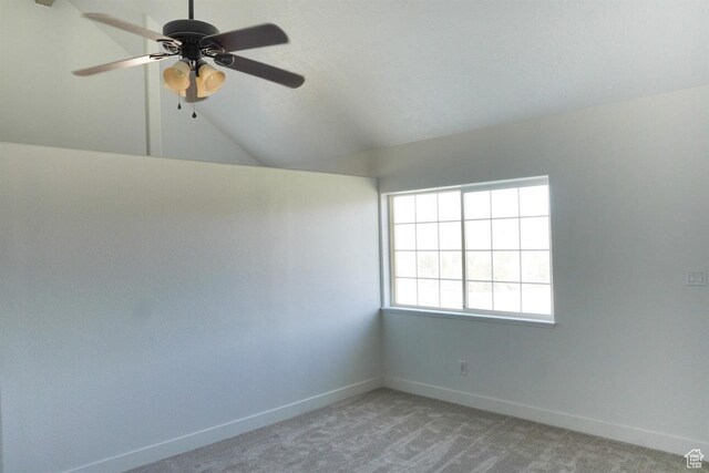 1204 Hyperion Way, Soda Springs, ID 83276 - spare room with baseboards, a ceiling fan, light carpet, and vaulted ceiling