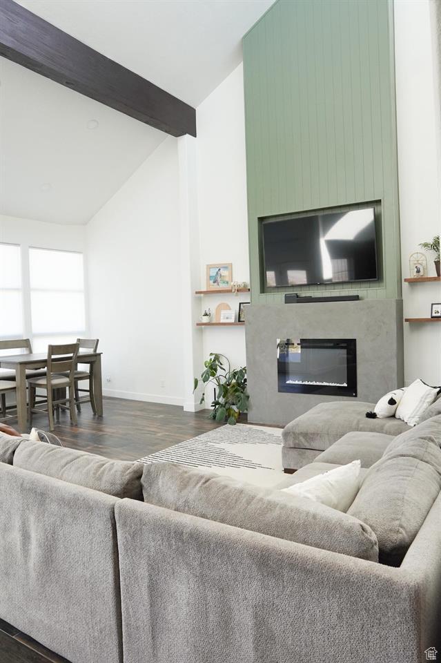 1204 Hyperion Way, Soda Springs, ID 83276 - living room with dark wood-style flooring, a fireplace, baseboards, high vaulted ceiling, and beam ceiling