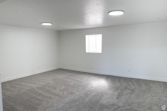 1204 Hyperion Way, Soda Springs, ID 83276 - unfurnished room with carpet floors, baseboards, and a textured ceiling