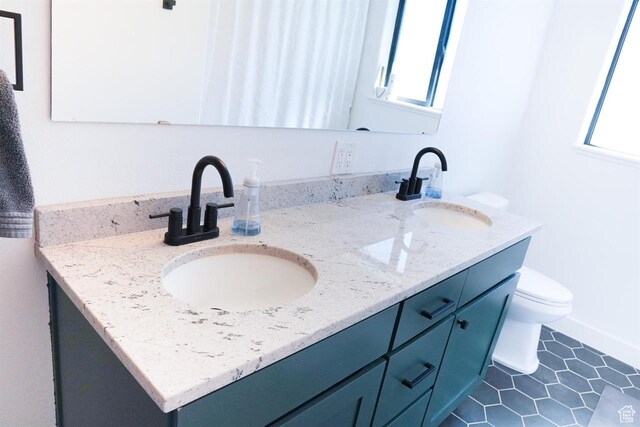1204 Hyperion Way, Soda Springs, ID 83276 - bathroom featuring double vanity, healthy amount of natural light, and toilet