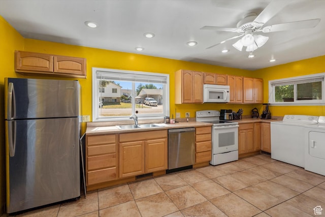 5305 S 2700 W, Roy, UT 84067 - kitchen featuring appliances with stainless steel finishes, separate washer and dryer, a sink, light countertops, and light tile patterned flooring
