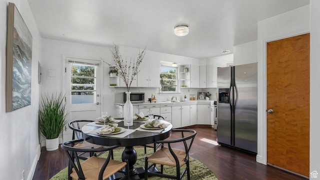 23 W Cottage Ave, Sandy, UT 84070 - dining room featuring dark wood-type flooring and baseboards