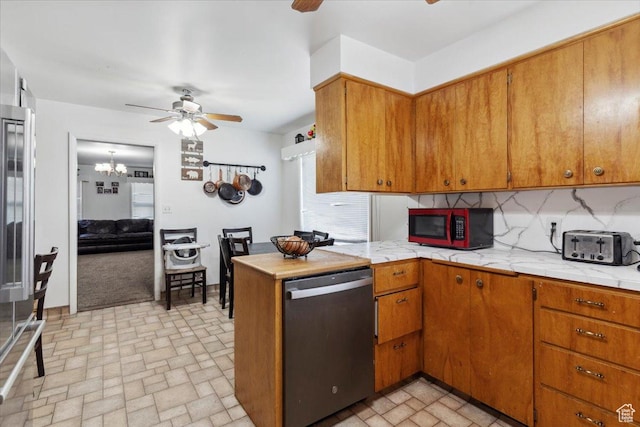 339 S Main St, Smithfield, UT 84335 - kitchen featuring stainless steel dishwasher, ceiling fan, light countertops, and brick patterned floors