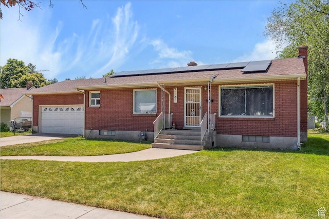 339 S Main St, Smithfield, UT 84335 - ranch-style home with brick siding, an attached garage, a chimney, and a front lawn