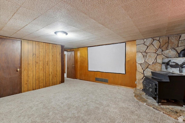 339 S Main St, Smithfield, UT 84335 - cinema with carpet, a wood stove, and wood walls