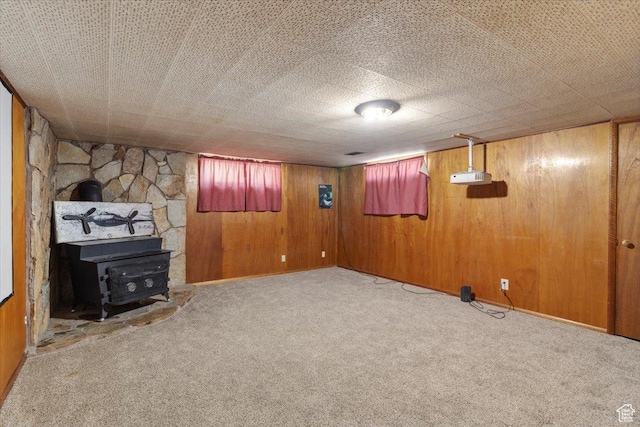 339 S Main St, Smithfield, UT 84335 - below grade area featuring carpet flooring, a wood stove, and wood walls