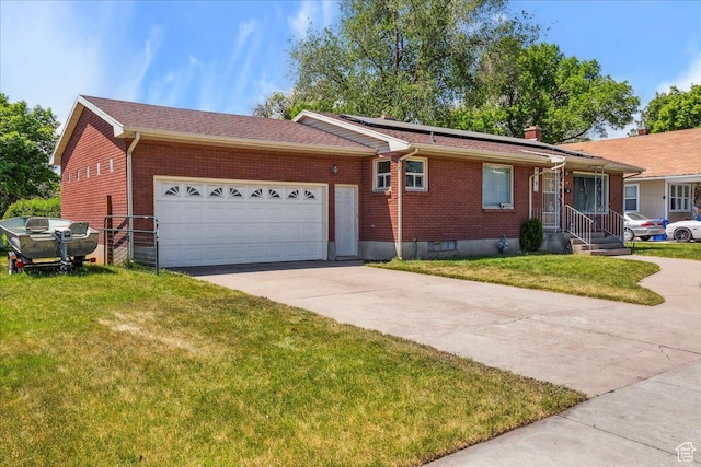 339 S Main St, Smithfield, UT 84335 - single story home featuring brick siding, concrete driveway, a garage, and a front yard