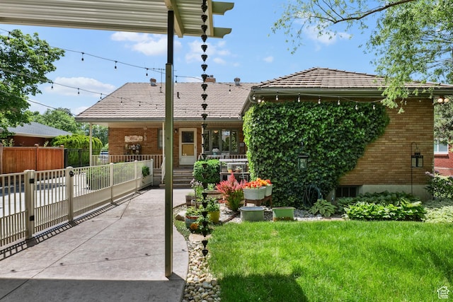 1377 E Wilson Ave, Salt Lake City, UT 84105 - view of front of home featuring covered porch, brick siding, and a tiled roof