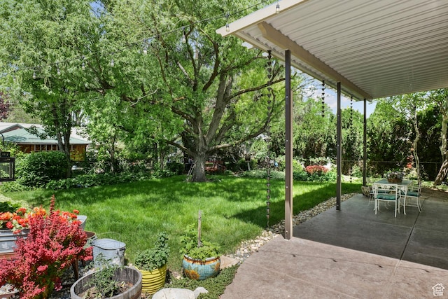1377 E Wilson Ave, Salt Lake City, UT 84105 - view of green lawn with a patio, view of scattered trees, and outdoor dining space
