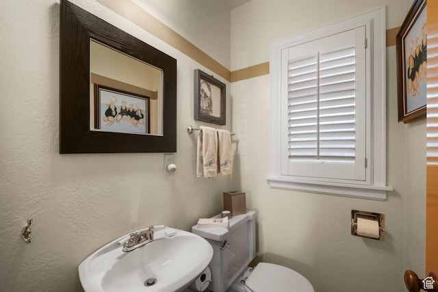1377 E Wilson Ave, Salt Lake City, UT 84105 - half bathroom featuring a sink and toilet