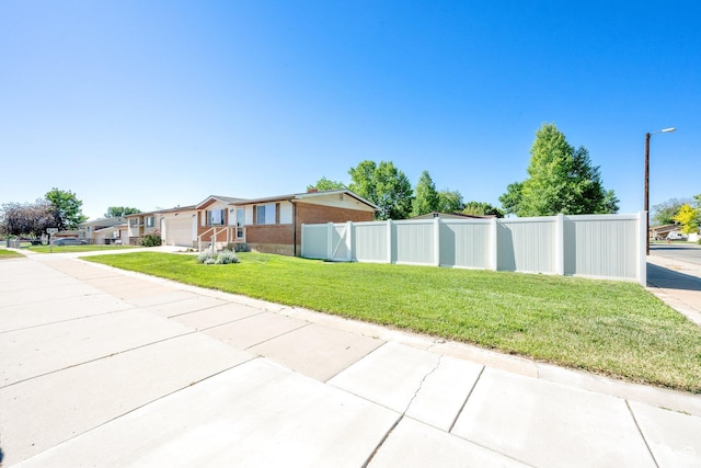 648 W 2200 N, Clinton, UT 84015 - view of side of property featuring an attached garage, brick siding, and driveway
