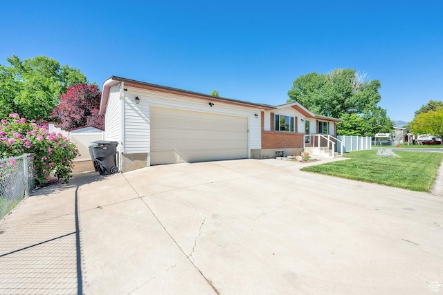 648 W 2200 N, Clinton, UT 84015 - ranch-style house featuring concrete driveway and an attached garage