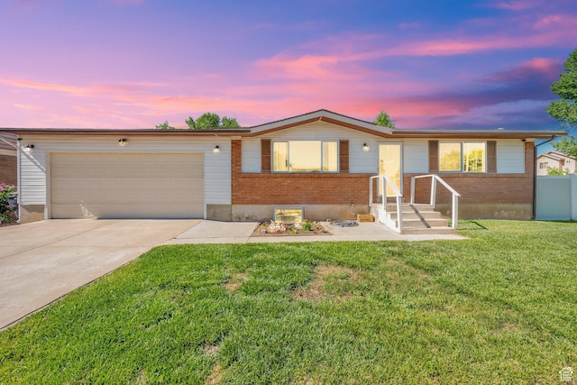 648 W 2200 N, Clinton, UT 84015 - ranch-style house with brick siding, a garage, and concrete driveway