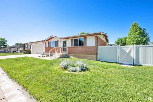 648 W 2200 N, Clinton, UT 84015 - view of front of home with brick siding, a gate, driveway, and a garage