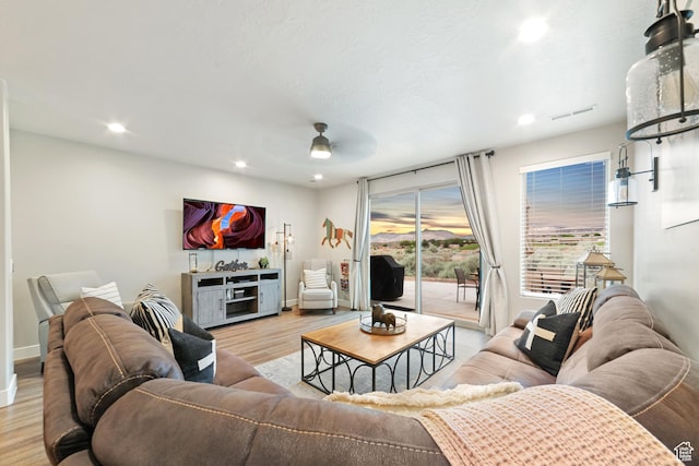 5048 N Escapes Dr, St George, UT 84770 - living room featuring ceiling fan, light wood-style floors, recessed lighting, and baseboards