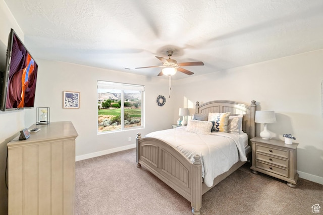 5048 N Escapes Dr, St George, UT 84770 - bedroom featuring baseboards, light carpet, and a ceiling fan