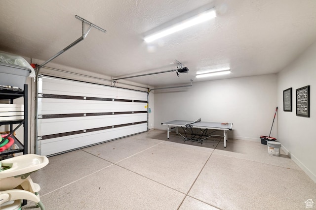 5048 N Escapes Dr, St George, UT 84770 - garage featuring baseboards and a garage door opener