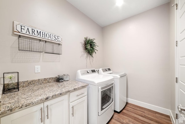 5048 N Escapes Dr, St George, UT 84770 - laundry area with independent washer and dryer, light wood-style floors, baseboards, and cabinet space