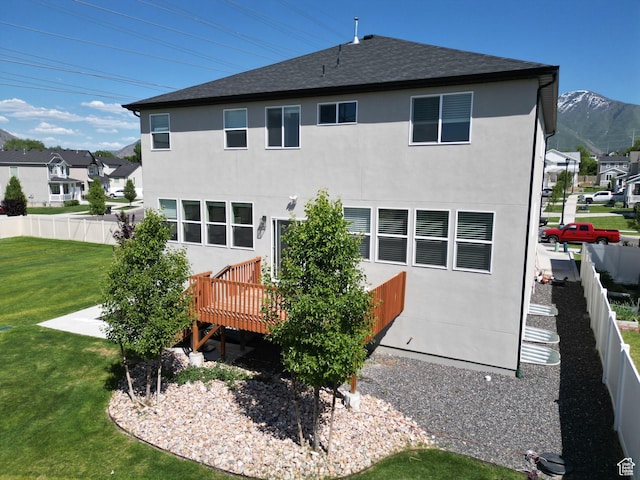 1573 N Woodside Dr, Spanish Fork, UT 84660 - back of house featuring a deck, stucco siding, and a shingled roof