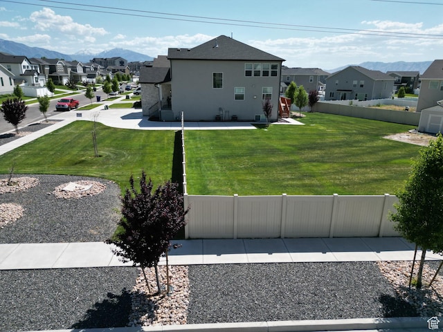 1573 N Woodside Dr, Spanish Fork, UT 84660 - rear view of house featuring a residential view, stucco siding, and a mountain view