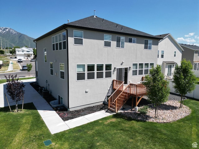 1573 N Woodside Dr, Spanish Fork, UT 84660 - back of property with stucco siding and a lawn