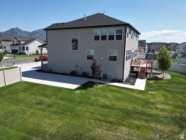 1573 N Woodside Dr, Spanish Fork, UT 84660 - back of property featuring a residential view, a deck with mountain view, a patio area, and stairs