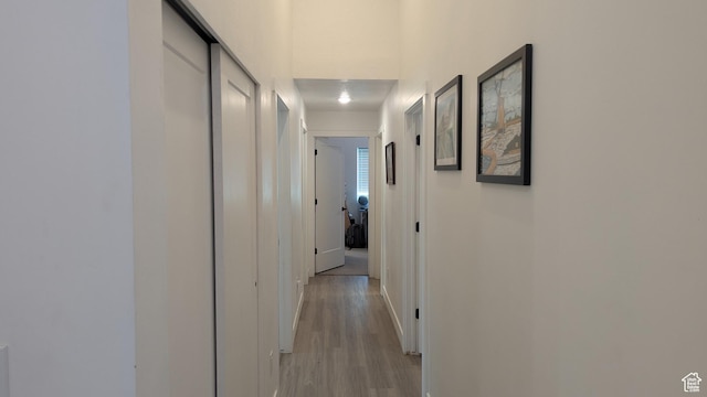 3065 S Brinker Ave, Ogden, UT 84403 - hallway with light wood-type flooring and baseboards