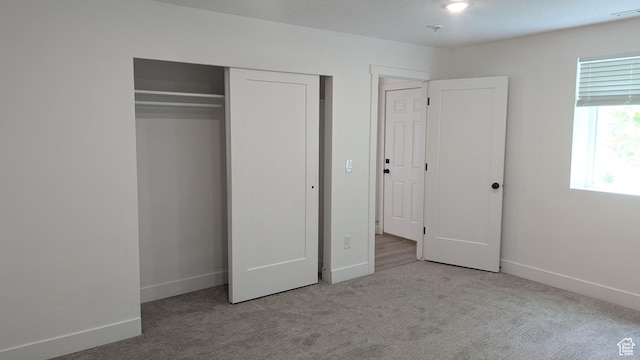 3065 S Brinker Ave, Ogden, UT 84403 - unfurnished bedroom featuring carpet flooring, baseboards, and a closet