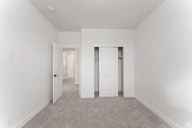 6134 S Kelly Ln, St George, UT 84790 - unfurnished bedroom with carpet flooring, baseboards, a closet, and arched walkways