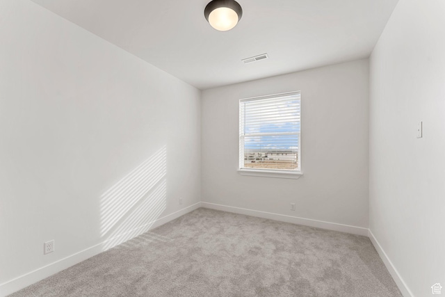 6134 S Kelly Ln, St George, UT 84790 - spare room featuring light colored carpet and baseboards