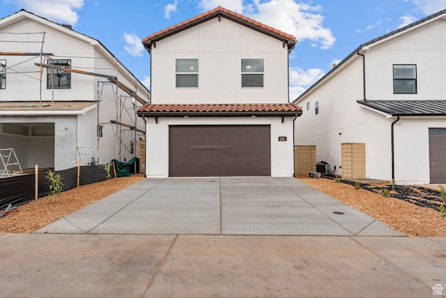 6134 S Kelly Ln, St George, UT 84790 - mediterranean / spanish house with a tiled roof, a garage, stucco siding, and concrete driveway
