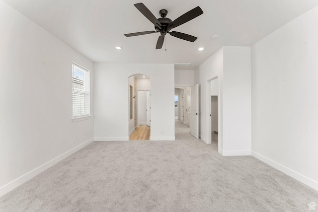 6134 S Kelly Ln, St George, UT 84790 - unfurnished bedroom featuring arched walkways, light carpet, baseboards, and recessed lighting