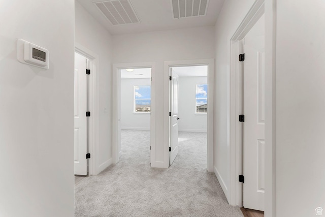 6134 S Kelly Ln, St George, UT 84790 - corridor featuring light carpet and baseboards