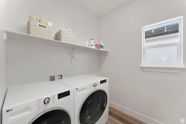 6134 S Kelly Ln, St George, UT 84790 - washroom featuring washer and dryer, baseboards, and light wood finished floors