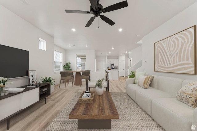 6134 S Kelly Ln, St George, UT 84790 - living room with light wood-style flooring, a ceiling fan, and recessed lighting